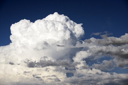 Giant cumulonimbus clouds in the deep blue color sky.の写真素材