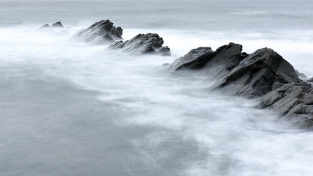A long exposure photography with sea rocks