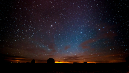Night sky with stars above Monument Valley