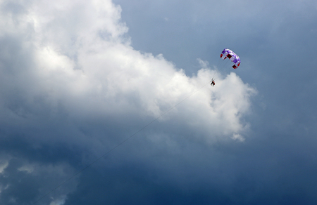 Parasailing and cloudsの写真素材