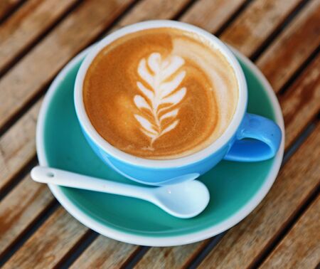 Cappuccino in blue cupの写真素材