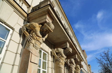 The building facade with telamons - Warsaw, Poland