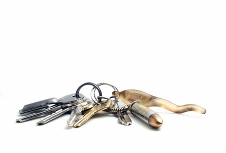 keys with keychain and pendants on white background