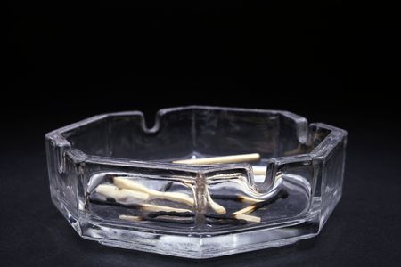 ashtray with burned matchsticks, shallow depth of fieldの写真素材