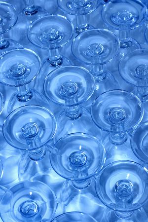 many upside-down lined up glassesの写真素材