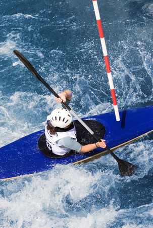 kayaker manoeuvring in calm blue riverの写真素材