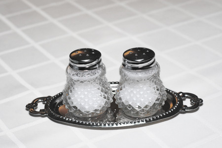 two salt shakers isolated on white backgroundの写真素材