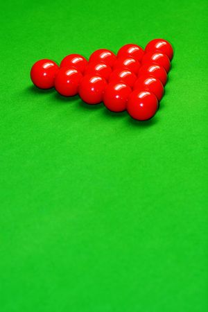 snooker balls on green surface, shallow depth of field