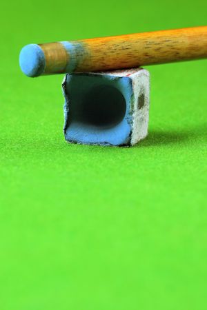 cue stick wit chalk block, shallow depth of fieldの写真素材