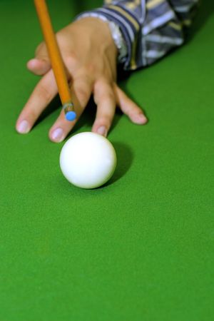 Snooker player hitting a ball, shallow depth of fieldの写真素材