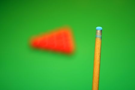 Cue stick and snooker balls over green surface, shallow depth of fieldの写真素材
