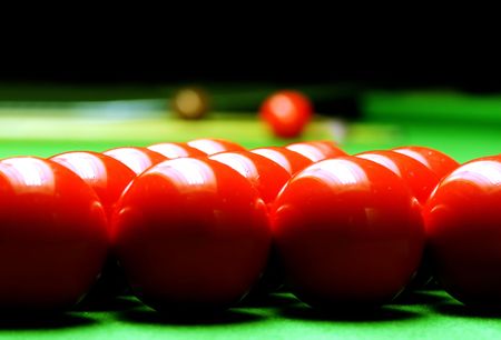 snooker balls on green surface, shallow depth of field