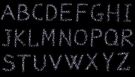 letters made with diamonds (glass) on black backgroundの写真素材