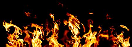 flames and fire burning on black backgroundの写真素材