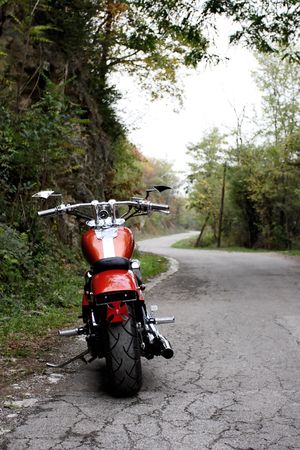 motorcycle on a road in the forestの写真素材