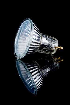small halogen lightbulb isolated on black, with reflectionの写真素材