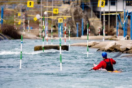 kayaker manoeuvring in white waterの写真素材