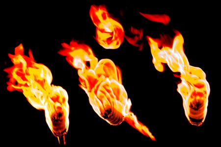 flames and fire burning on black backgroundの写真素材
