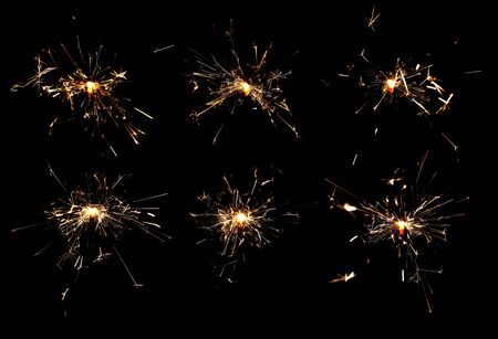 many burning spakrlers isolated on black backgroundの写真素材
