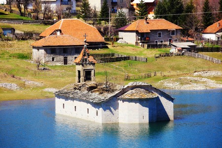 church underwater in the Mavrovo Lake, Macedoniaの写真素材