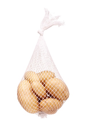 bunch fresh potatoes in a white mesh bagの写真素材