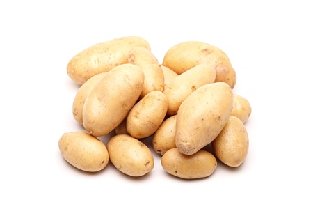 bunch of fresh potatoes against whiteの写真素材