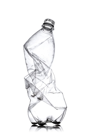 smashed empty plastic bottle, isolated on white backgroundの写真素材