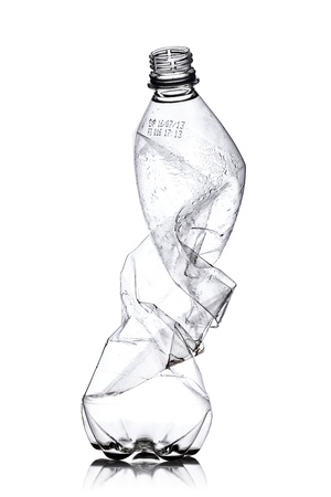 smashed empty plastic bottle, isolated on white backgroundの写真素材