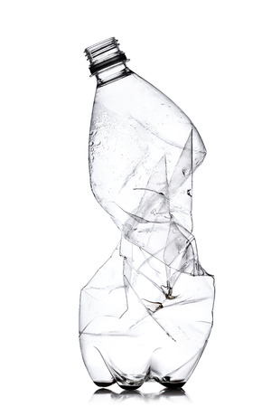 smashed empty plastic bottle, isolated on white backgroundの写真素材