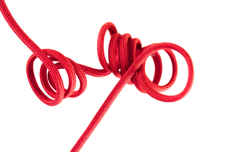 red shoe lace against white backgroundの写真素材