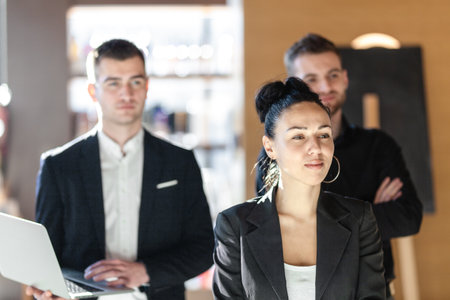 Team of three business people looking forward.の写真素材