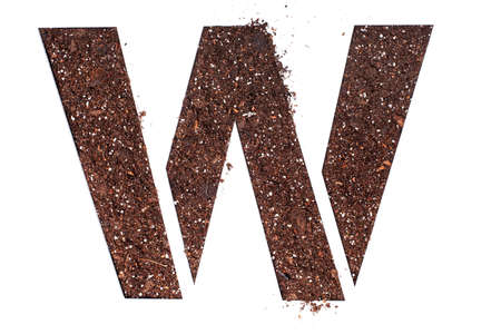 stencil letter W made above dirt on white surfaceの写真素材