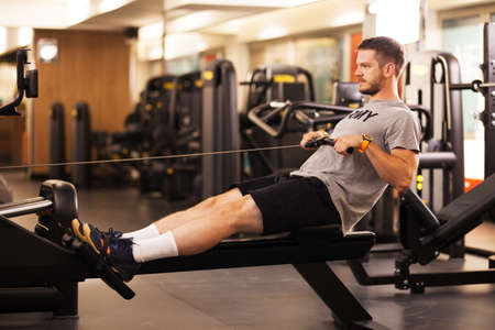 fitness man working out on a gym machine