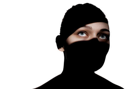Fashionable studio portrait of a cute girl. Silhouette of a beautiful young woman with hard shadows...