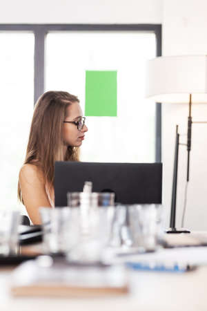 Business people having a creative meeting in an office. Businesswoman sitting at table.の写真素材