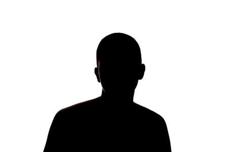 Silhouette of a girl with very short hair. Studio portrait against white background.の写真素材