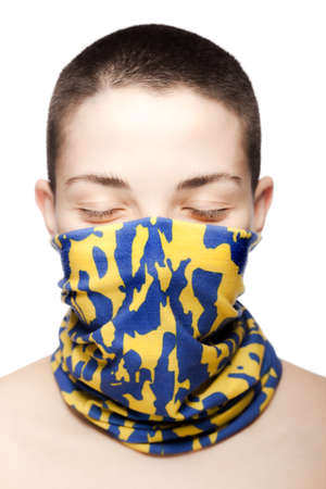 Cute girl with short hair wearing fashionable bandana over her face and neckの写真素材