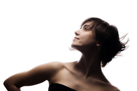 Half silhouette portrait of a girl with short hairstyle. Isolated against white backgroundの写真素材