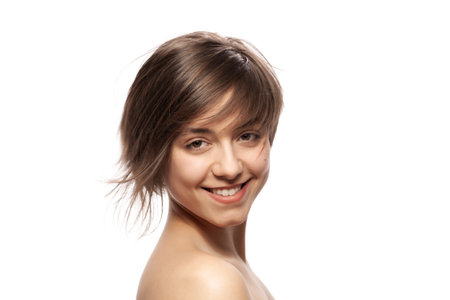 Beautiful girl fashion portrait. Smiling with wavy hair.の写真素材
