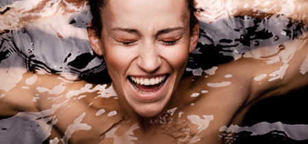 Underwater beauty portrait of a beautiful caucasian girl. Looking at camera.の写真素材