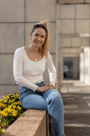 Portrait of a beautiful girl looking at camera and smiling.の写真素材