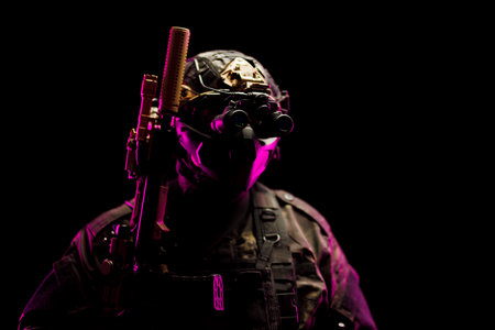 Special forces soldier with tactical gear and night vision in dramatic lightingの写真素材