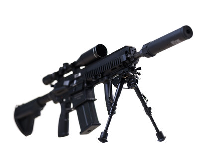 Detailed view of a modern scoped rifle with silencer on a tripod isolated on white backgroundの写真素材