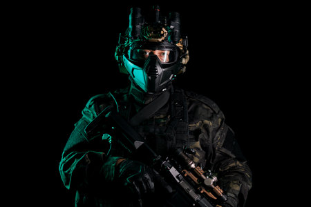 Tactical Operator in Full Gear Holding Weapon with Night Vision Opticsの写真素材