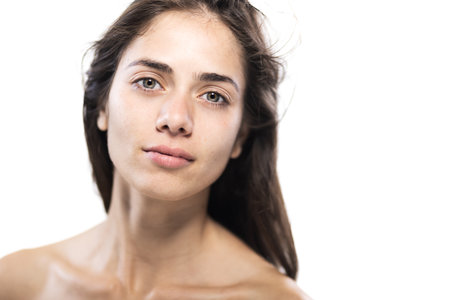 Natural beauty portrait of a young woman with bare shoulders in studioの写真素材
