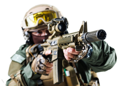 Close-Up of Armed Tactical Soldier Holding a Rifle in Defensive Positionの写真素材