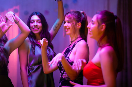 Women enjoying a lively party together in a vibrant and fun atmosphereの写真素材