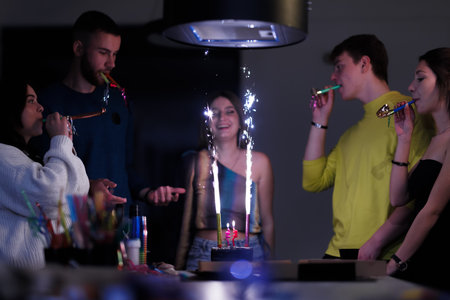 Friends Celebrate With Cake and Party Horns in Festive Atmosphere