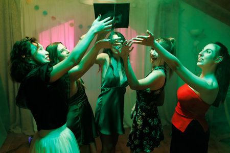 Group of young women celebrating and having fun together indoors