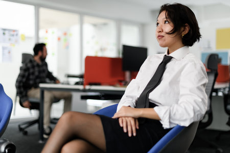 Business meeting in a modern office with professionals discussing strategies and ideas during the afternoonの写真素材